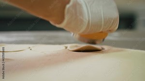 Cook cuts out circles in the raw dough with an iron mold. Cooking dumplings