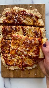 Did you know you can make pizza crust with just 2 ingredients? Whip up this crust and add any toppings you like! Pizza night is just a few minutes away! This recipe is perfect for a weeknight dinner with the family! Ingredients: 1 1/4 cup self-rising flour more for dusting 6 oz plain Greek yogurt 1/2 cup pizza sauce 1 cup shredded mozzarella Optional: Basil, red pepper, or parmesan. Instructions: Preheat the oven to 450 degrees. Spray a baking sheet with non-stick spray and set aside. Mix the fl