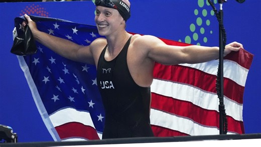 Katie Ledecky wins her 22nd world swimming title with victory in 1500-meter freestyle in Singapore