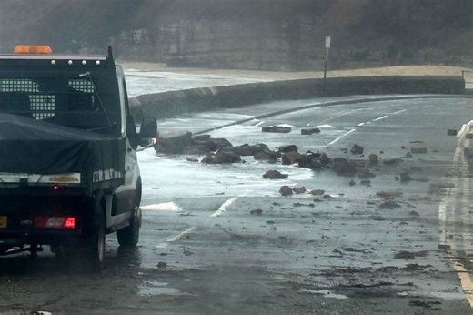 'Terrifying' waves smash sea defences and swamp roads on Anglesey