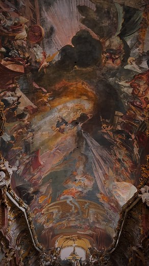 Asamkirche (St. Johann Nepomuk) is a small but stunning Baroque in Munich. It was built between 1733 and 1746 by the Asam brothers, Egid Quirin (a sculptor and stucco artist) and Cosmas Damian Asam (a painter and architect), as their private chapel and showcase of artistic skill. Despite its narrow façade squeezed between residential buildings, the interior is lavishly decorated with dramatic stucco, gilding, frescoes, and sculptures. The design follows a vertical structure: dark tones at the en