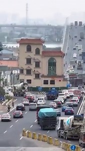 A house in the middle of the street.