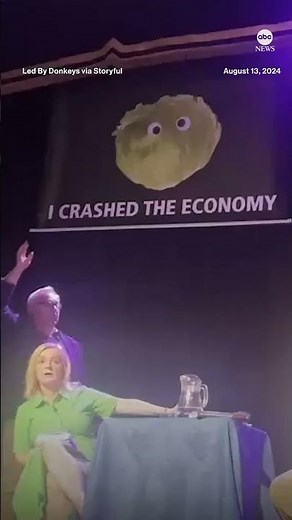 Former U.K. Prime Minister Liz Truss storms offstage after lettuce banner is unfurled during talk