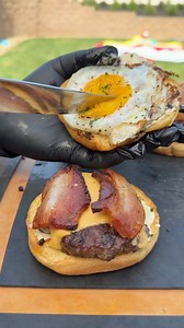 🔥 Breakfast burgers on the Chiasson Smoke Rocket Stove? That’s how you kick off a summer morning! 🥓🍳 Perfect for camping trips, tailgates, or any spot where you want real fire flavor without hauling a big setup. This little beast heats fast, cooks like a champ, and brings the smoke wherever you go.Who else is adding this to their summer gear lineup? | Miguels cookingwithfire