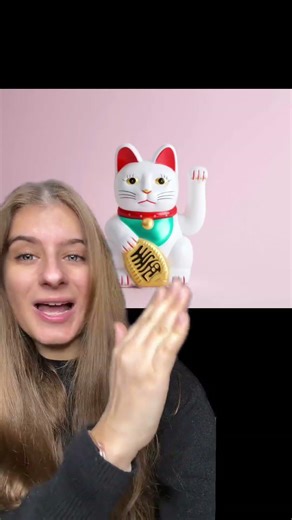 Why do we see this cat with its paw raised in Asian stores? 🐱