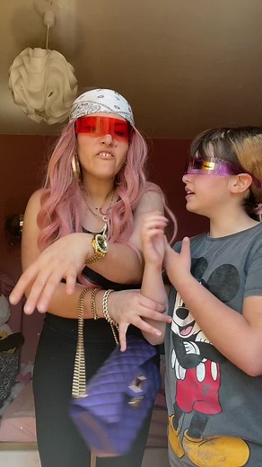 Creative Indoor Performance with Pink Hair and Mickey Mouse