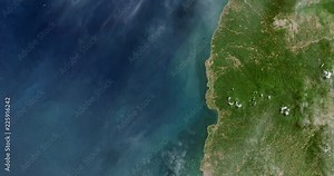 Very high-altitude overflight aerial of the west Java coast and Java sea. Clip loops and is reversible. Elements of this image furnished by USGS/NASA Landsat