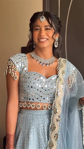 Charithra Marlecha Beauty on Instagram: "Every Indian bride usually dreams of a traditional look for her engagement, but she thought differently ✨ She wanted something soft, modern, and minimal, a look that felt fresh, elegant, and truly her. 💍 The best part? She didn’t come with references or requests. She just smiled and said, “I trust you.” 🩵 So we created a look that enhanced her natural features, glowing skin, softly defined eyes, a touch of shimmer, and a subtle lip that tied everything 