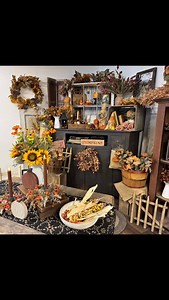 Fall is all about layering—especially when it comes to your decor! Stack your risers, add texture with woods and metals, and don’t forget the florals. 🌻 Just grab a few floral picks and start creating your own cozy, one-of-a-kind arrangements. ✨ The best part? There’s no wrong way to do it—it’s all about what makes your home feel warm and welcoming to you. What’s your go-to fall floral? Sunflowers, bittersweet, or pumpkins mixed in? 👇 #RedFoxPrimitives #FallDecorating #LayeredCozy #PrimitiveSt