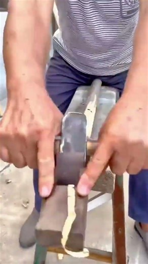 Smoothing a Thin Wooden Strip with Precision Using a Sharp Handheld Wood Plane