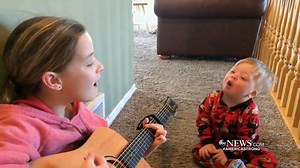 POWER OF MUSIC: A brother and sister from Heber City, Utah, have gone viral with a video showing big sister Lydia strumming “You Are My Sunshine” and toddler brother Bo, who has Down syndrome, learning words by singing the song. David Muir reports. http://abcn.ws/2DhoVvn #AmericaStrong | ABC World News Tonight with David Muir