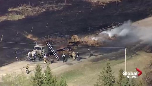Semi hauling hay bales catches fire south of Edmonton