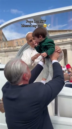 Pope Leo crosses a sign of the cross on the face of a little boy #popeleoxiv