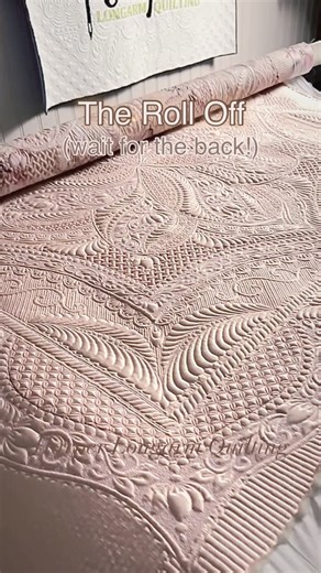 Harper Longarm Quilting on Instagram: "I know everyone loves the roll off videos! Here ya go! Such a relief and sense of accomplishment when I finished this wholecloth quilt. It was on my list of goals for last year and I did it!! It’s an original design - drawn up by me. It took 47 tedious hours to turn my 60” piece of blush satin fabric into this gorgeous work of art for my studio wall. The story is not over for this project. More details to come. #harperlongarmquilting #quilt #quiltersofinsta