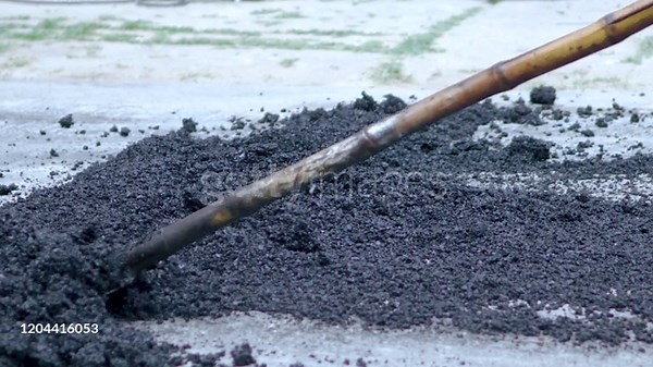 Worker use the Ground Compactor for construction road