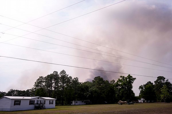 Wildfires across Georgia and Florida destroy more than 50 homes and force evacuations