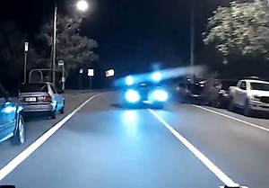 Shocking footage shows the moment an allegedly drunk Mercedes-Benz driver veers into the opposite lane and narrowly avoids colliding with a police car on the Sunshine Coast. 😨 The the driver allegedly blew four times more than the legal limit. Story: https://bit.ly/3uTndXL | Courier Mail