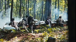 Airsoft Team Waiting Defending the Sandbag Bunker in the Forest