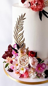 31 reactions · 3 comments | This gorgeous floral wedding cake is the result of days of painstaking careful hand shaping of wafer paper and gum paste flowers. Truly such a lovely final result. #wedding #weddingcake #customcake #weddinginspiration #weddingplanning #botanicals #floral #flowers #baltimorebakery #baltimore #waferpaperflowers #waferpaper | Charm City Cakes | Facebook
