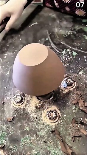 Carving floral linocut pattern using blue-handled gouge tooln