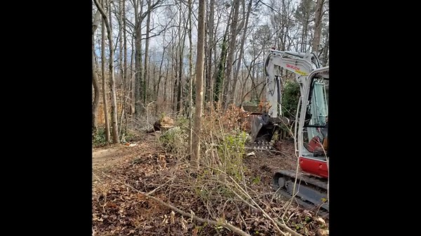 Land clearing and mulching using a Takeuchi TB370 excavator - mulching with Rockhound Defender