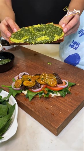 Avocado Hummus Sandwich 🥪 Ingredients: Sourdough bread Hummus Spinach Tomatoes Red onions Sun-dried tomatoes dipped in oil Asian cucumber salad: Cucumbers Green onions White vinegar Soy sauce Chili powder Sesame seeds Salt Sugar Mashed avocado with lemon juice Cilantro chutney: Cilantro leaves Garlic clove Ginger Green chili Cumin powder Salt Black pepper | Lindsay Food