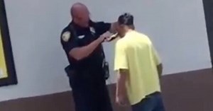 Viral video shows police officer helping homeless man shave for a job interview