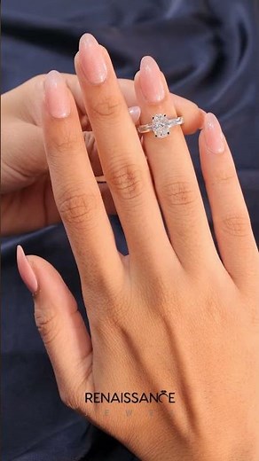 White gold Oval Solitaire Diamond Ring with Channel-Set Baguette Band and Four-Prong Setting