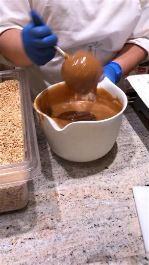 With or without nuts? These are the caramel apples being made at Disneyland’s Candy Palace. | Pastry with Jenn