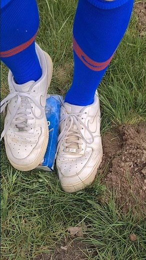 White Nike Air Force 1 low sneaker and soccer socks stomping burst tetra pack squirts