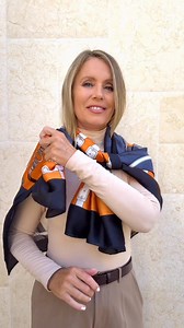 Try this easy silk scarf hack, perfect for any occasion. Fold the scarf lengthwise, drape it around your neck with one end shorter, and loop the short end over the longer one. Sweep the longer end around your back, bring it forward, and let it drape softly over your shoulder. Tuck it through the loose knot to finish. What do you think ? #scarf #scarves #scarftutorial #silkscarf | Blonde Beach Vibes