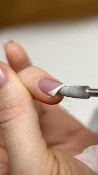 The full process of creating a manicure on natural nails — cat-eye design and French tips.