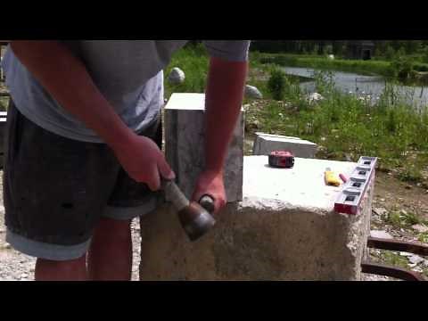 Stone mason splitting limestone