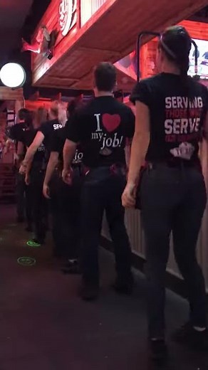 Texas road house waiters and waitresses give the customers a nice dance