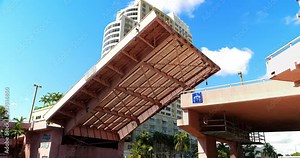 Drawbridge lowering down and closing the space for boat traffic in Fort Lauderdale, Florida, 4K