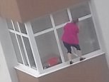 Jaw-dropping moment woman cleans windows with NO harness