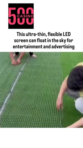 netflix.decode on Instagram: "- The post features a 14-second video of drones lifting an ultra-thin flexible LED screen to display vivid animations, including an American flag, fiery effects, and a woman's portrait, set against a city skyline at dusk. - This technology employs bendable LED modules on lightweight substrates like polyimide, weighing under 1 kg/m², allowing drone or balloon deployment for aerial ads, with prototypes emerging from Chinese firms since 2023 for events like festivals.