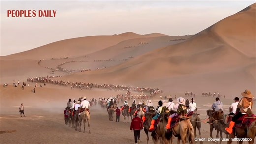 4.2K views · 234 reactions | Visitors flock to Dunhuang to experience camel riding. Seeing the camel caravan wind its way across the desert is truly magnificent, reminiscent of the ancient Silk Road. | People's Daily, China | Facebook