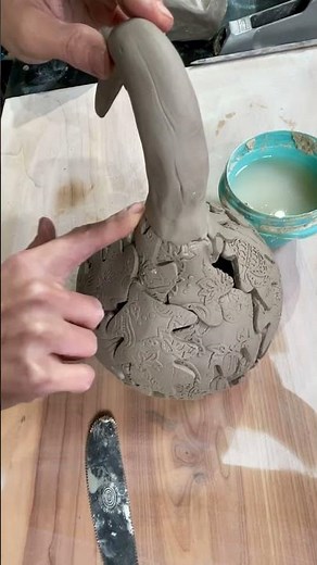 Making a stem for a gourd luminary. Check out my making and glazing gourds classes on ClayShare!