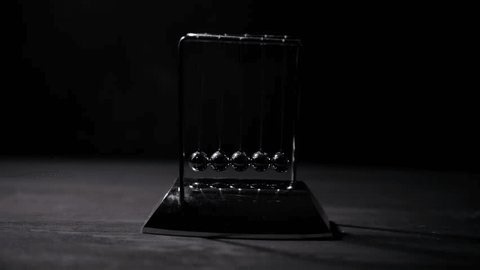 clip-3977737221-hand-starting-newton’s-cradle-motion-releasing-balls