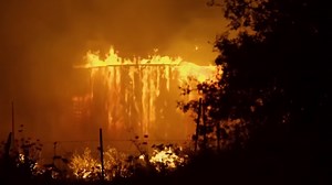 Watch how military cargo planes fight massive wildfires from the air