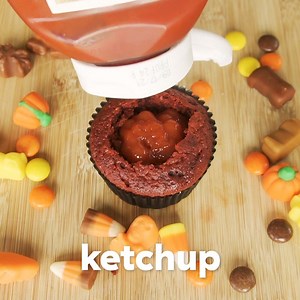 Halloween cupcakes... with a twist 👻🎃 Be as kind (or as sickly) as you dare when it comes to the secret fillings 😈 Recipe: https://trib.al/DKJyqtA | Cosmopolitan UK
