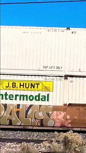 Intermodal railroad container train rapidly zooming by