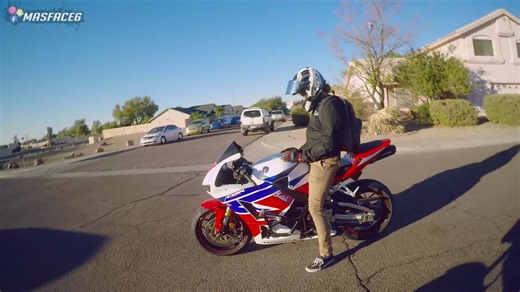 Rider repeatedly uses horn to interact with strangers creating humorous reactions