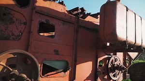 Download Old rusted tractor aged on farm land. Abandoned agricultural machinery for free