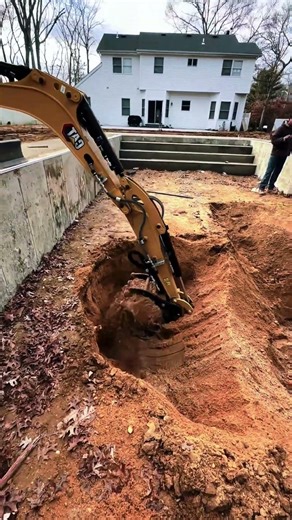 Excavating land for swimming pool construction project