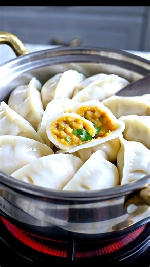 Dal Pitha (steamed, pocket-shaped rice flour dumplings)
