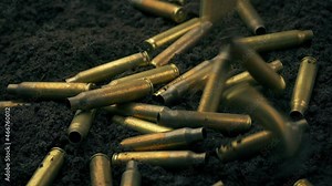 Shells Drop To Ground As Machine Gun Is Fired