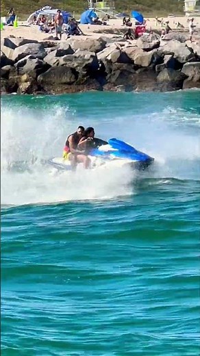 Girl rides jet ski at Haulover Inlet