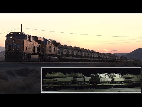 Military train hauls over a hundred tanks, armory and equipment through the night 🚂 🪖